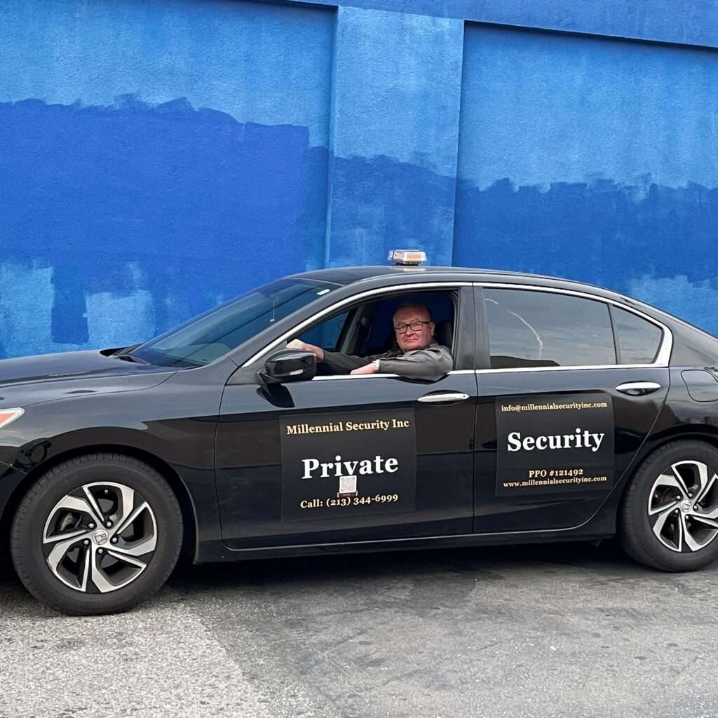 Millennial Security Inc. security officer in a marked patrol vehicle serving Los Angeles and Southern California