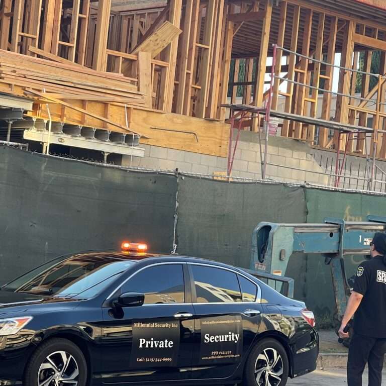 Millennial Security Inc. security officer and marked patrol vehicle protecting a construction site in Los Angeles, Southern California