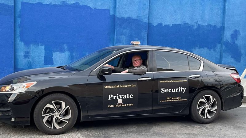 Millennial Security Inc. security officer in a marked patrol vehicle serving Los Angeles and Southern California